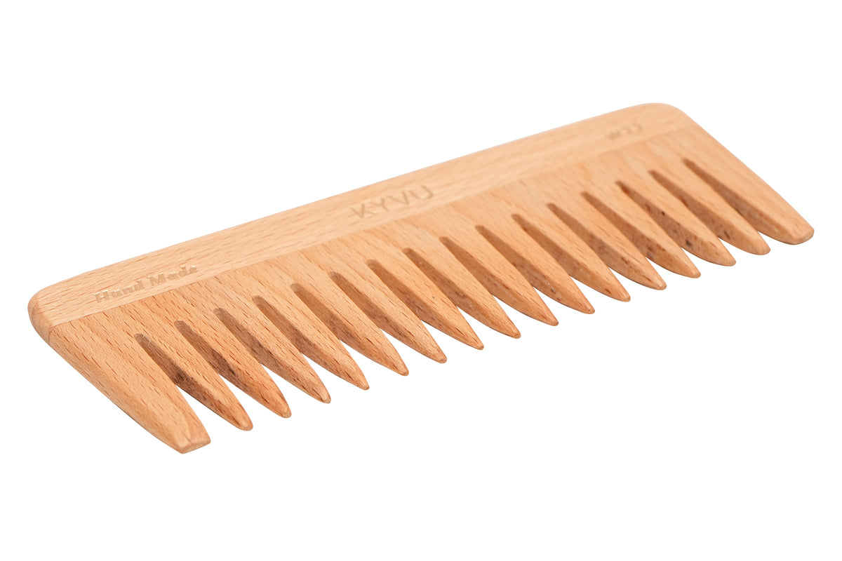 KYVU W22 wooden wide-tooth detangling comb, side view showing the wide-spaced steam beech teeth with hand-rounded tips
